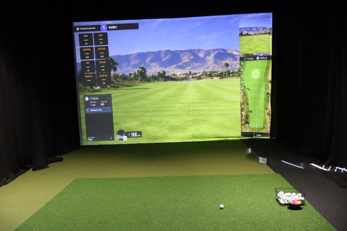 Empty simulator bay with virtual course displayed